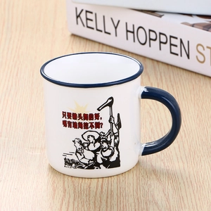 Detail of retro ceramic mug with blue rim on wooden table featuring funny vintage illustration