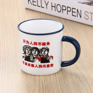 Detailed view of nostalgic ceramic mug with retro illustrations on a wooden table