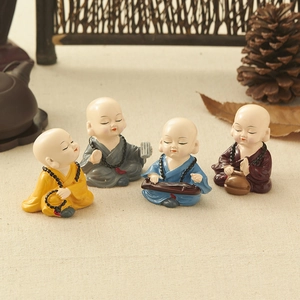 Set of four colorful resin little monk figurines for Zen home decor and car dashboard