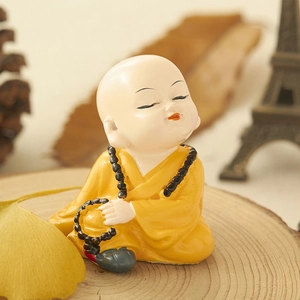 Set of resin Kung Fu monk statues in yellow robes for zen car interior decoration