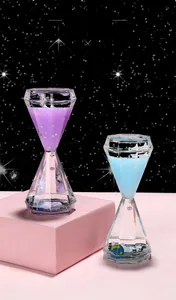 Macro detail of diamond-cut acrylic oil timer featuring tiny astronaut and spaceship models