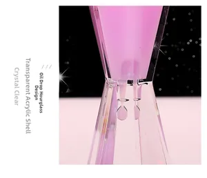 Detail of pink liquid oil timer showing the dripping effect inside acrylic shell