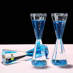 Creative astronaut liquid motion bubbler with blue stardust in diamond acrylic case