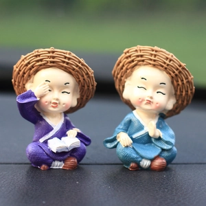 Set of two resin little monk figurines with straw hats for car dashboard decoration