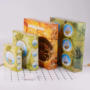 Detail view of four vintage sailing boat model gift boxes with nautical map patterns