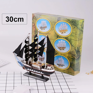 Detailed 30cm vintage sailboat model with black and white hull and wooden masts
