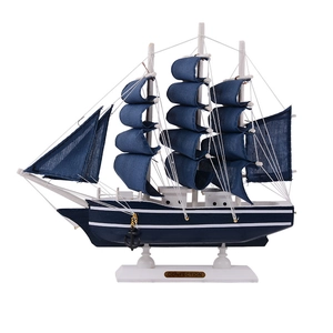 Nautical sailboat model in deep blue and white finish for modern home shelf decor