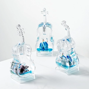 Mediterranean violin desk decor with blue liquid and floating ocean miniatures