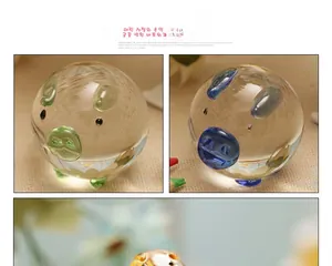 Detailed close-up of cute transparent crystal pig figurines with colorful ear accents