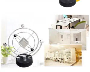 Kinetic orbital motion gadget with silver metal rings on a black base for desk decor