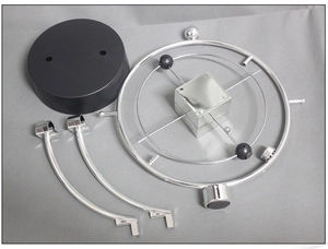 Components of kinetic orbital perpetual motion desk toy with silver rings and base