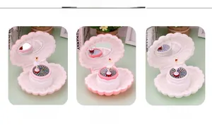 Shell music box with dancing ballerina in light pink, pink, and white color options