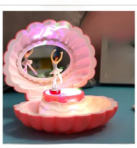 Pink shell music box detail with rotating ballerina and glowing multi-color LED lights