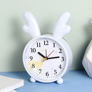 White minimalist desktop alarm clock with cute antlers and reindeer silhouette dial