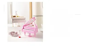 Mini piano music box in pink and white with a ballerina figurine and keyboard detail