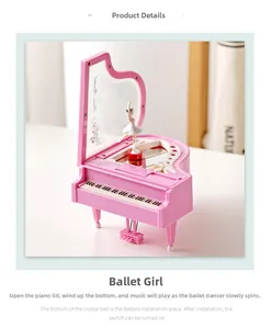 Detail of pink piano music box with rotating ballerina and interior vanity mirror