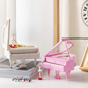 Classic piano music box in pink and white with a rotating magnetic ballerina dancer figurine