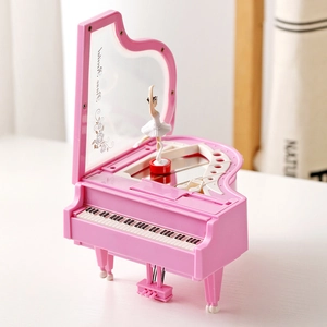Pink grand piano music box with rotating ballerina and mirror showing Piano Recital text