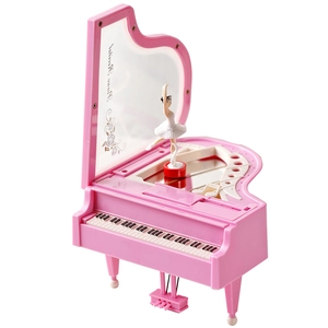 Pink piano music box with ballet dancer figurine and interior floral mirror display
