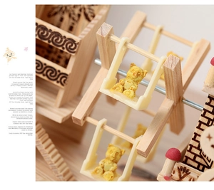 Macro shot of 3D wooden Ferris wheel music box featuring a cute yellow resin bear