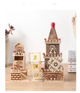 Detailed close-up of wooden music box featuring a Ferris wheel and cozy cottages
