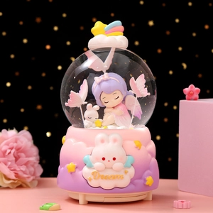 Detailed view of angel girl musical crystal ball with soft LED light and dream rabbit base