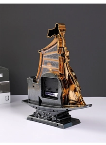 Back view of vintage sailing boat alarm clock showing quartz movement and battery compartment