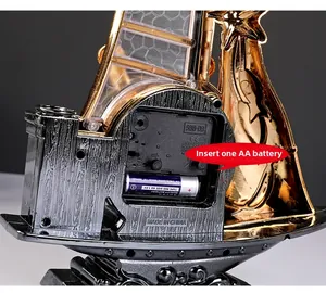 Detail view of the vintage sailboat clock back showing quartz movement and battery slot