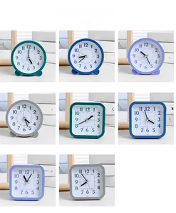 Minimalist silent desk clock variety showing round and square shapes in soft colors