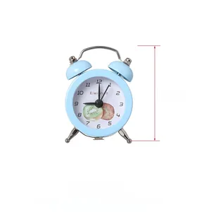 Mini light blue twin bell alarm clock with kiwi fruit pattern dial and 7.5cm height