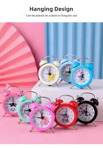 Macro shot of colorful mini alarm clocks with cute fruit patterns and hanging loop