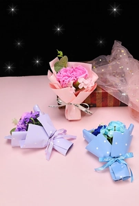 Close-up of artificial soap flower bouquets with Just for you ribbon in a gift box