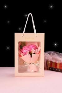 Detail view of pink soap flower bouquet in a gift bag with Just for you ribbon