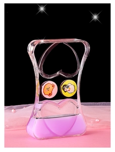 Detail view of heart-shaped liquid timer with purple oil and cute floating characters