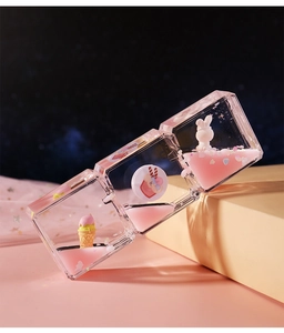 Detail of three-compartment liquid glitter timer with pink bunny and star sequins