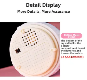 Detailed bottom view of musical crystal ball base with switch and AAA battery compartment