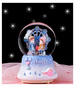 Close-up of Ferris wheel crystal ball music box with Sweet embossed base and sequins