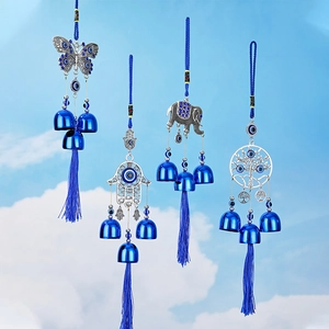 Blue evil eye wind chime set with silver metal butterfly, hamsa, and elephant motifs