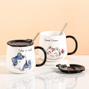 Cartoon cat ceramic mugs set with lids and spoons featuring cute illustrations and text