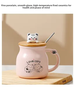 Detailed view of pink ceramic cat mug with wooden lid, 3D kitten topper and metal spoon