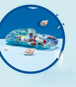 Macro shot of transparent sports car oil leakage decor with blue sand and sea shells