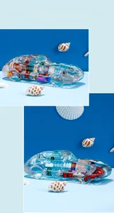 Macro view of a retro resin race car paperweight with colorful beads and shell accents