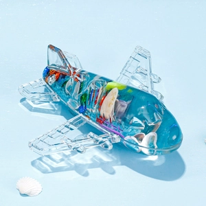 Adorno de escritorio creativo con forma de avión con conchas y relleno de arena azul
