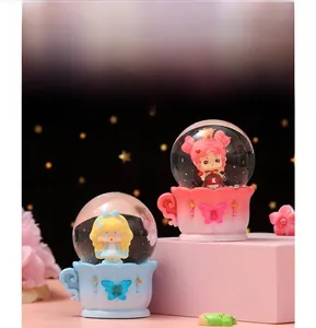 Close-up of glowing ocean crystal balls with cute figures in colorful cup bases