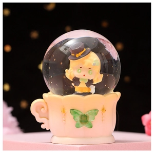 Close-up of luminous crystal ball featuring a cute cartoon girl inside a teacup base