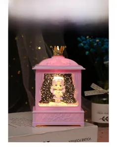 Detail of Lolita night light showing pink crown frame and cute girl figurine with LED glow