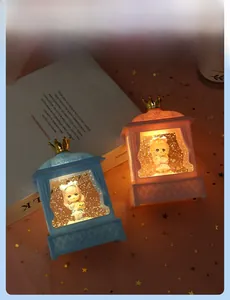 Close-up of heart-themed glowing crystal night lights with crown top and glitter