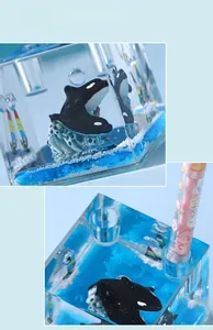 Creative marine theme pencil holder featuring floating orca and liquid ocean scene