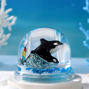 Orca whale crystal ball ocean timer liquid motion desk ornament with a surfer