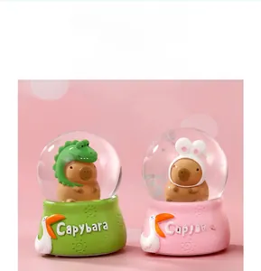 Close-up of cute capybara crystal ball night lights with dinosaur and bunny ear hats
